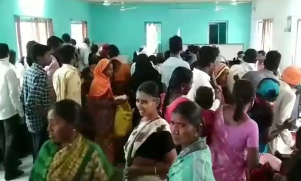 People waiting at Mee Seva centres to link their mobile phone numbers with ration cards