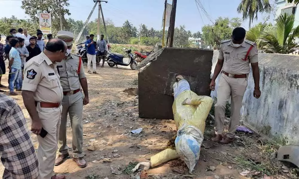 Police examining the demolished NTR statue at Dosakyalapalli village on Friday