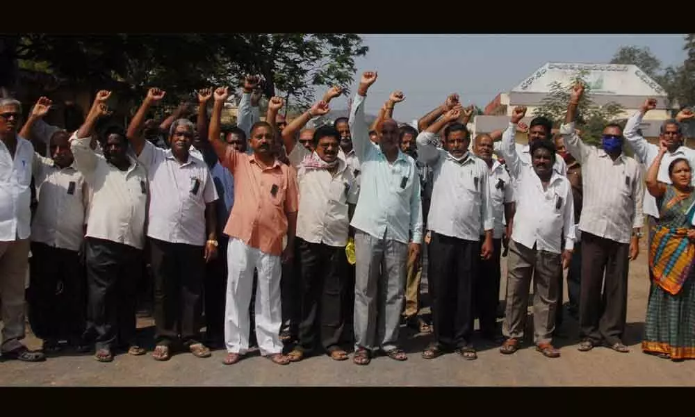 Ongole dairy employees protesting in front of the dairy for clearance of VRS benefits and other dues on Friday