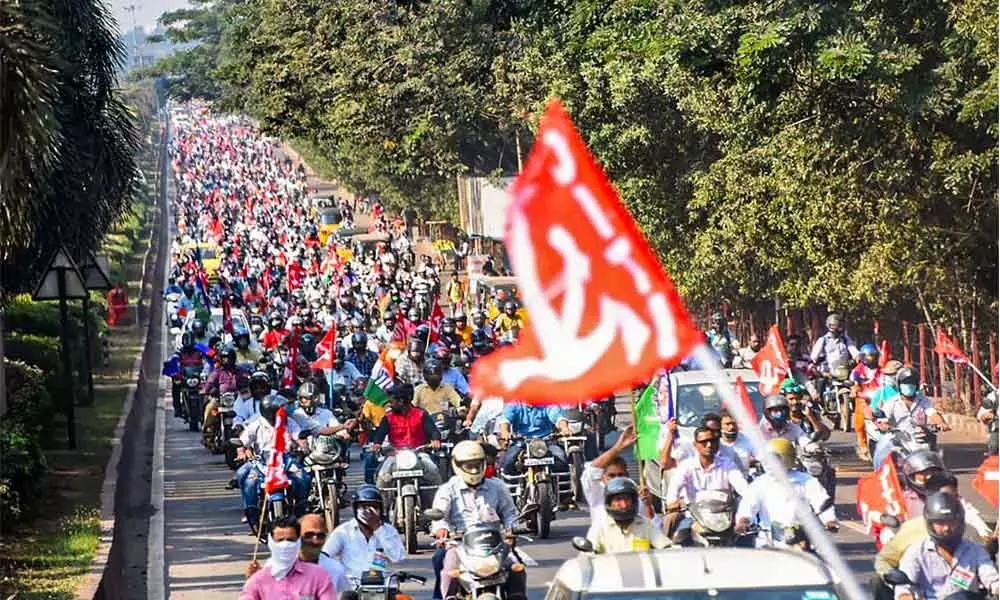 Visakhapatnam Steel Plant employees take part in a massive bike rally to protest against the move to privatise the steel plant, in Visakhapatnam