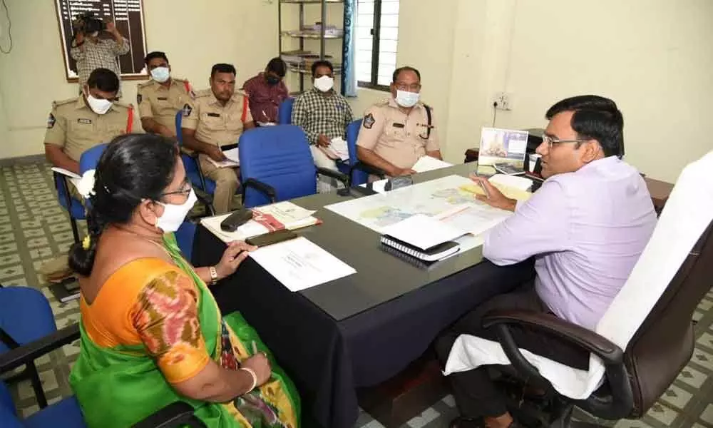 District Collector K V N Chakradhar Babu interacting with the officials at RDOs office in Naidupet on Saturday