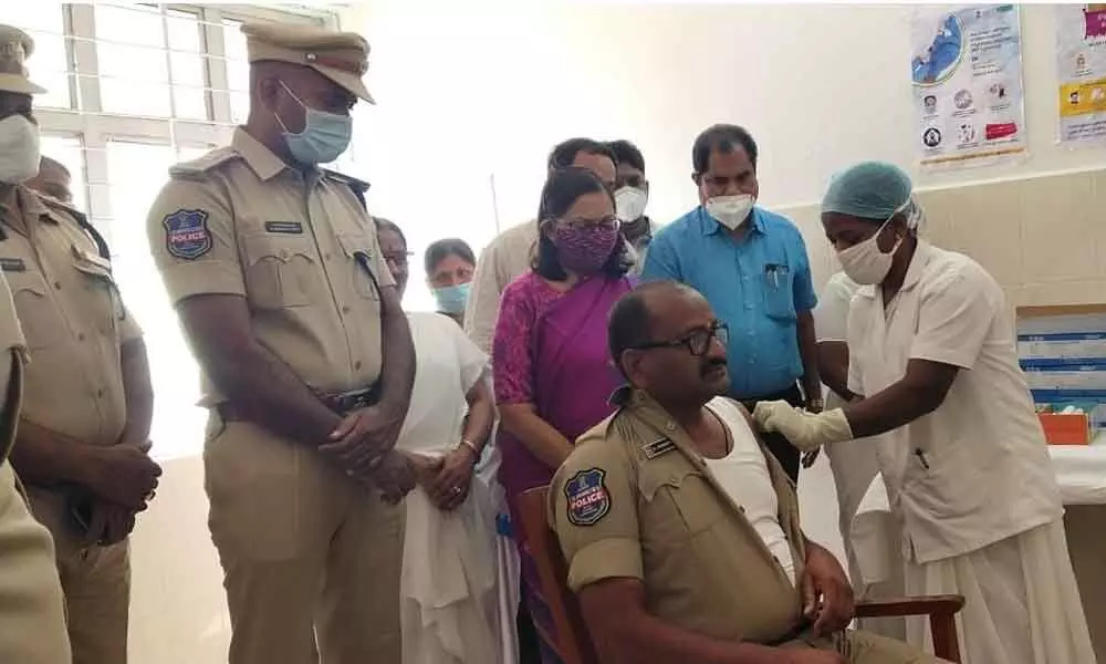 District Collector Anita Ramchandran examining the administration of Covid vaccine to  a police official at Area hospital in Bhongir on Saturday