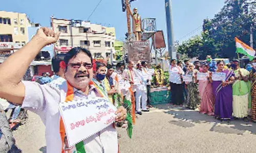 Congress leaders staging a protest against privatisation of Visakhapatnam Steel Plant, in Tirupati on Saturday