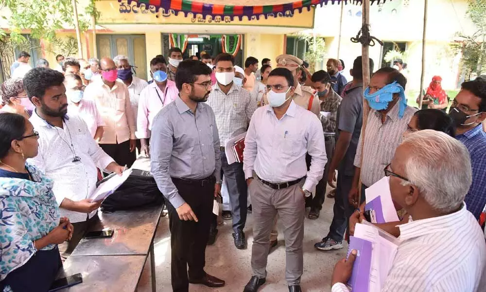 District Collector Vivek Yadav and Tenali Sub-Collector Mayur Ashok inspecting arrangements  at polling centres in Tenali division on Monday