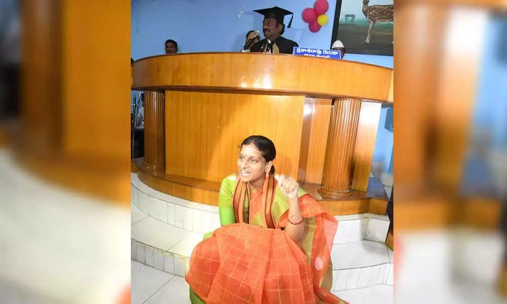 BJP Corporator Chada Swathi squatting before Mayors podium in Warangal on Monday