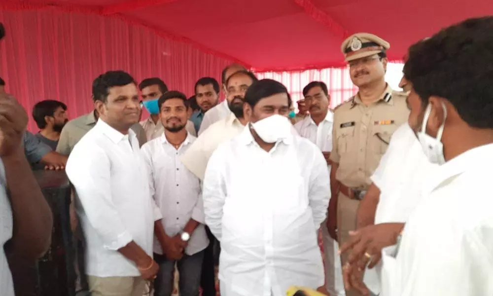 Minister Jagadish Reddy along with MLAs Gadari Kishore and Bhoopal Reddy checking with the officials concerned about the  arrangements for public  meeting at Halia on Tuesday