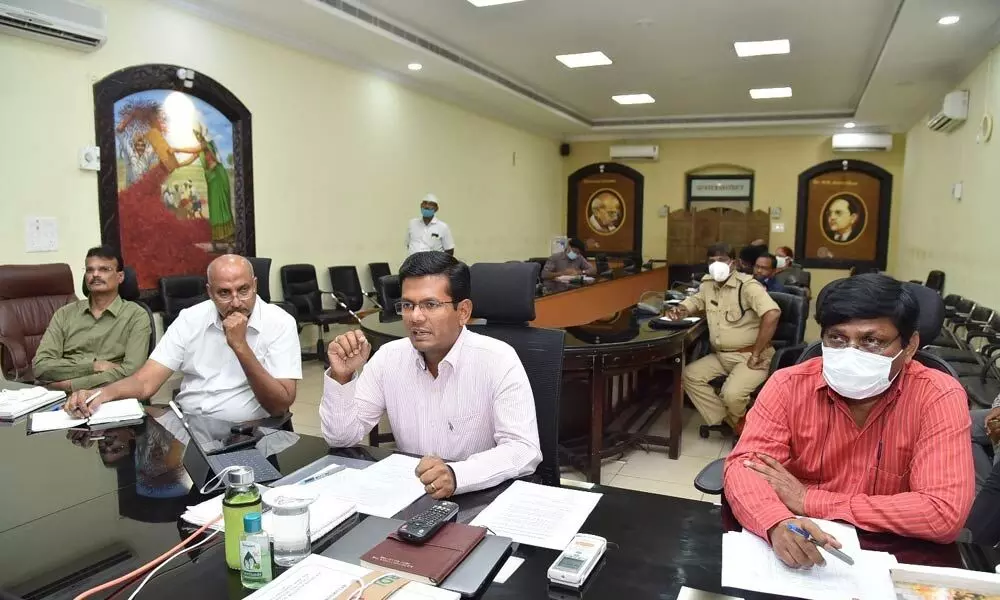 Joint Collector AS Dinesh Kumar convening videoconference with officials in Guntur on Wednesday