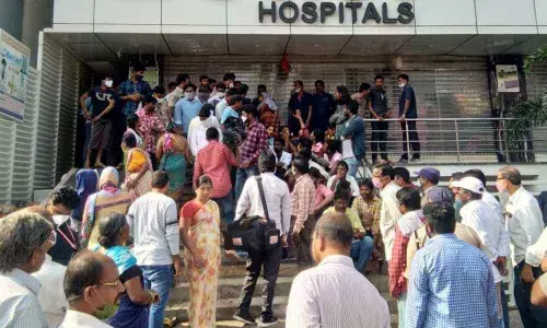 Parents and relatives of the deceased staging a dharna in front of a private hospital in Khammam on Wednesday
