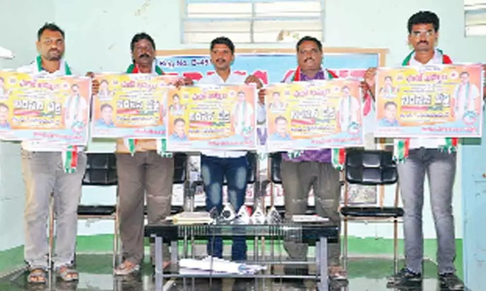 Yuva Telangana Party leaders releasing wall posters of one-day deeksha, in Khammam on Thursday