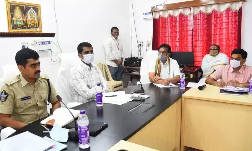 District Collector M Hari Narayanan conducting a review meeting with temple officials on Mahasivaratri Brahmotsavams in Srikalahasthi on Thursday