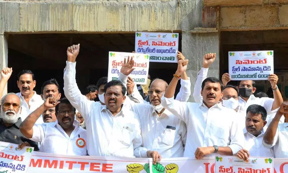 Builders JAC members staging protest in Vijayawada on Friday
