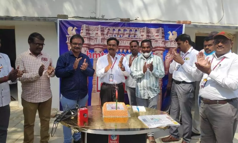 Kapil Group’s Director U Krishna Mohan cutting a cake on 12th anniversary of HMTV, in Warangal on Friday
