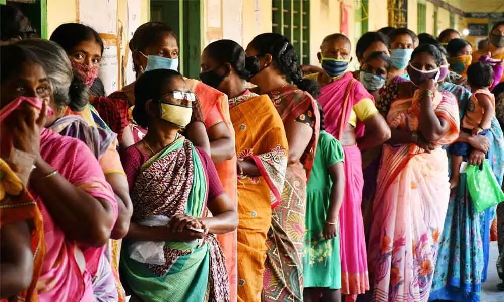 Women waiting in a queue line to cast their votes in the second phase of panchayat polls at a polling centre at Pamarru in Krishna district on Saturday 	Photo: Y Vinay Kumar