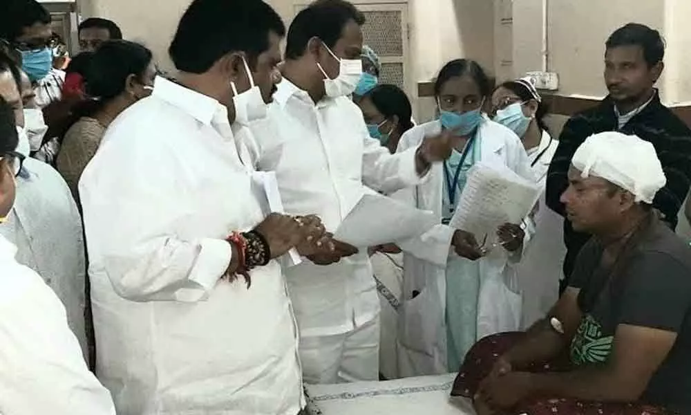Health Minister Alla Kali Krishna Srinivas and Tourism Minister M Srinivasa Rao interacting with accident victims at KGH in Visakhapatnam on Saturday