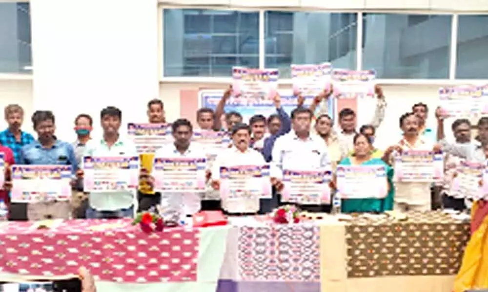 Chairman of AP Contract and Outsourcing Employees JAC K Suman and other leaders releasing a poster during their meeting in Tirupati on Sunday