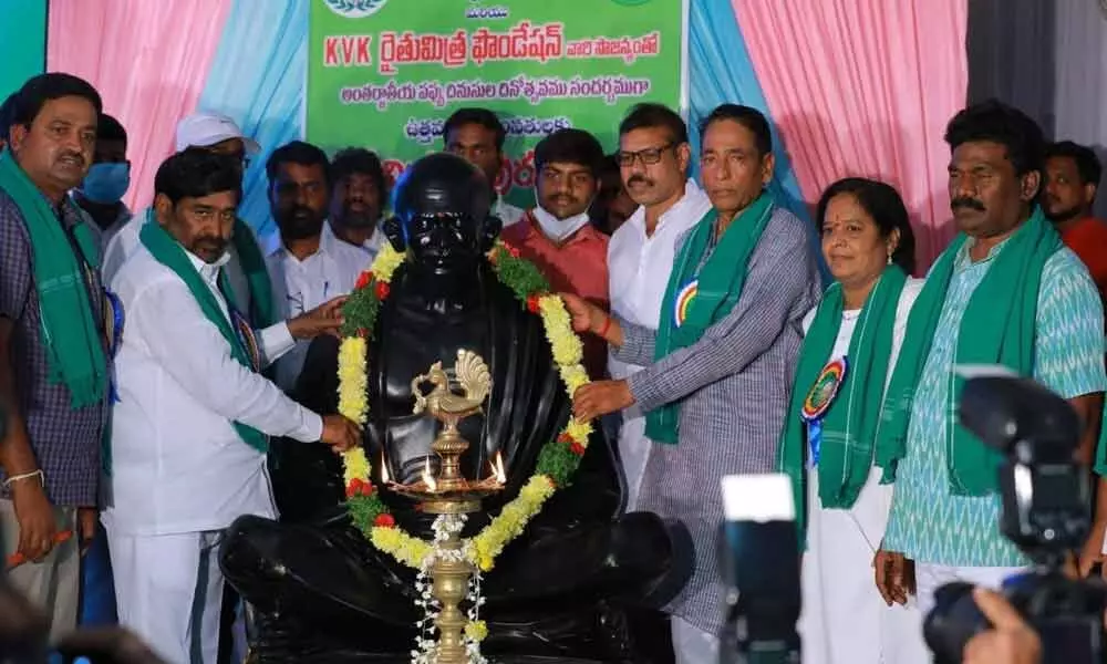 Energy Minister G Jagadish Reddy garlanding Gandhi statue before commencing farmers’ meeting in Suryapet on Sunday