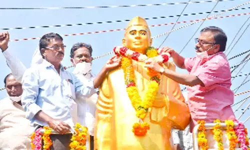 Prakasam district Collector Dr Pola Bhaskara garlanding the statue of Damodaram Sanjivayya in Ongole on Sunday