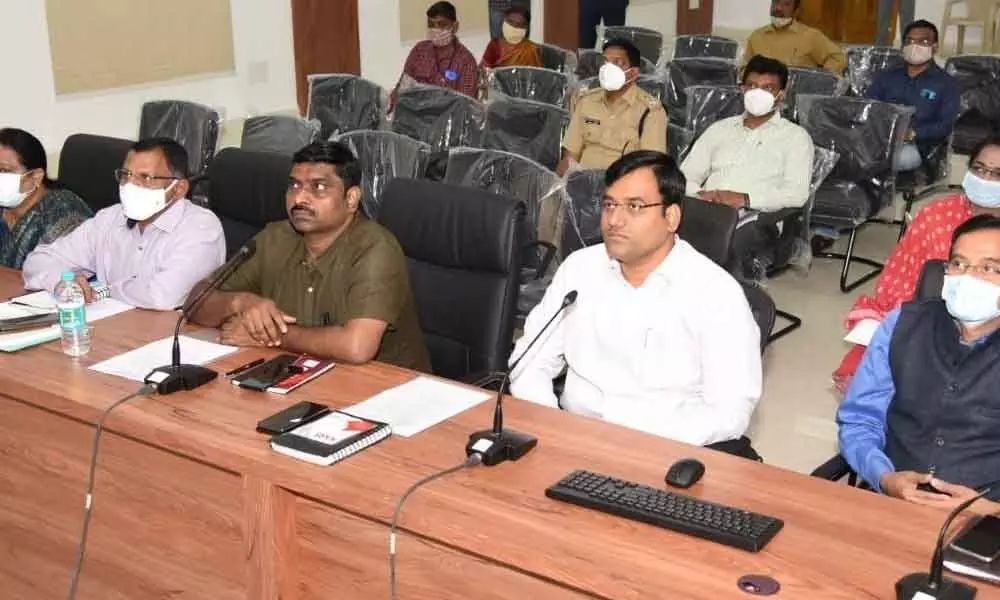 District Collector K V N Chakradhar Babu and poll observer P Basant Kumar conducting a review meeting with the election officials at the Collectorate in Nellore on Monday