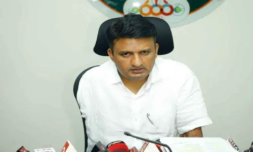 Municipal Commissioner P S Girisha addressing media at municipal office in Tirupati on Monday