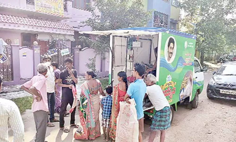 Ration delivery vehicle and people waiting for ration occupying roads