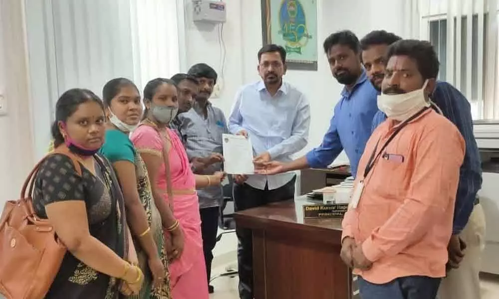 Government Arts College Old Students Association members submitting a memorandum to college principal Dr R David Kumar in Rajamahendravaram on Tuesday