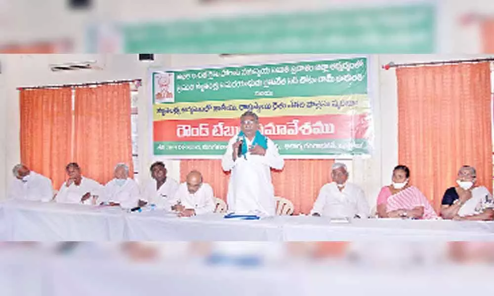 Chunduru Rangarao, Prakasam district convener of AIKSCC addressing the roundtable in Ongole on Tuesday