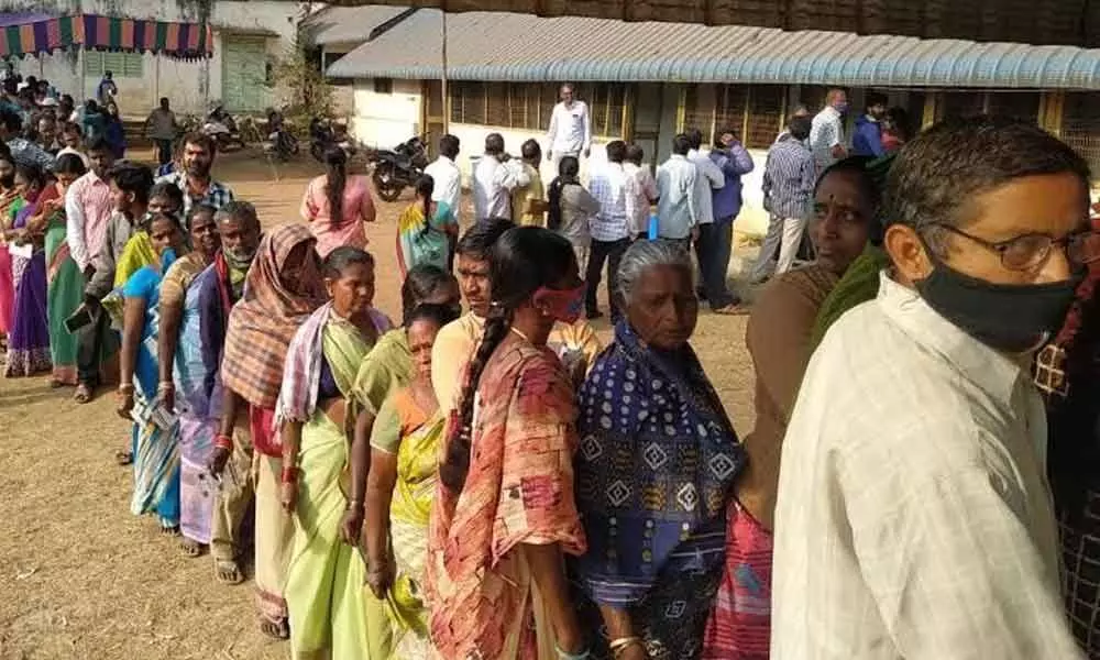 Voters waiting for their turn to exercise their franchise in panchayat elections at Paderu in Visakhapatnam