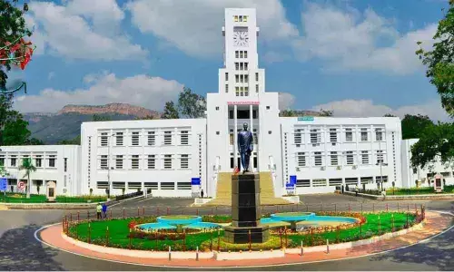 SVU Arts College Principal Prof B V Muralidhar and others participating in a webinar on Wednesday