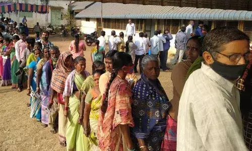 Voters waiting for their turn to exercise their franchise in panchayat elections at Paderu in Visakhapatnam