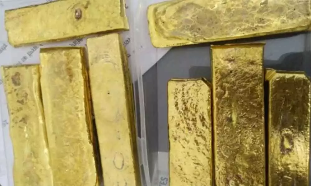 The customs officials on Thursday seized 1.4 kg of gold from two passengers who arrived at Rajiv Gandhi International Airport (RGIA) from Dubai.