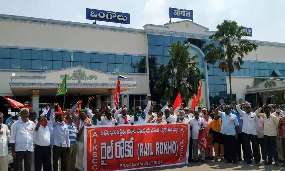 Farmers leaders addressing the protest in front of railway station in Ongole on Thursday