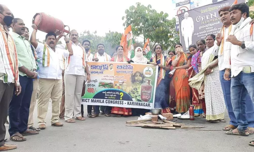 DCC women wing leaders and others staging a protest with gas cylinders