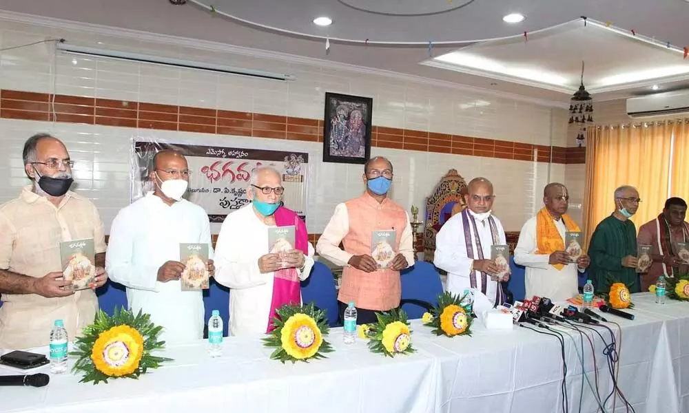 TTD EO Dr KS Jawahar Reddy releasing a book on Bhagavat Gita written in Telugu by former IAS officer P Krishnaiah (standing immediate right to the EO)  at  ISKCON centre in Tirupati on Thursday