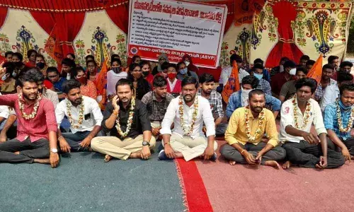 ABVP State secretary A Kiran participating in ‘Nirasana Deeksha’ along with students at KU administrative building in Hanamkonda on Thursday