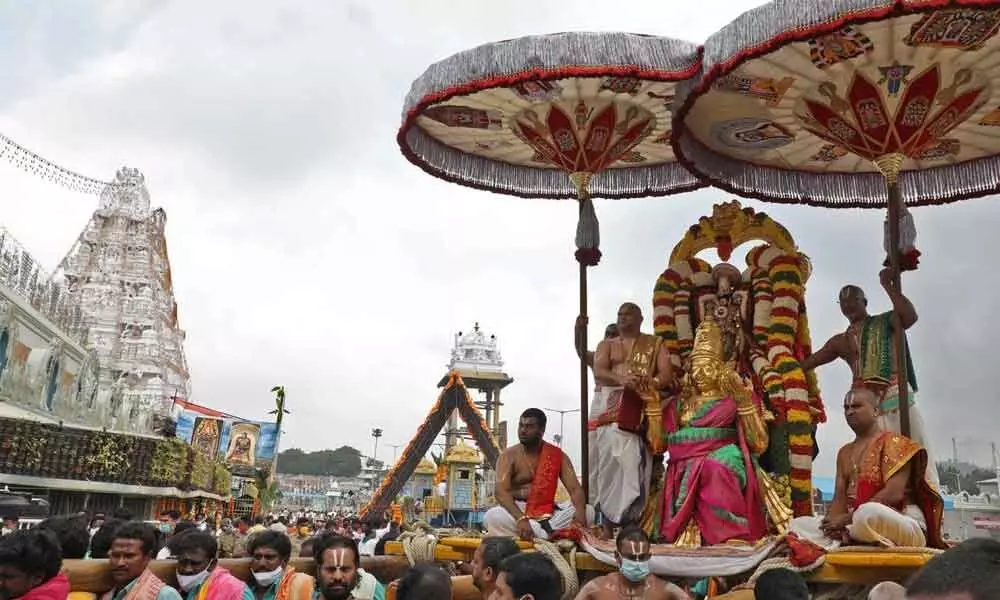 Lord Malayappa Swamy being taken out in a procession on Garuda Vahanam as part of Rathasapthami celebrations at Tirumala on Friday
