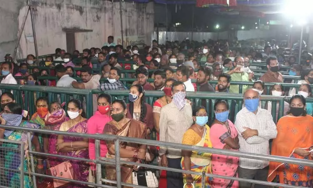 Devotees waiting in queue lines for darshan of Sun God at Arasavalli temple on Friday on the occasion of Rathasaptami