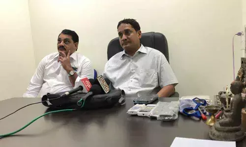 Anil Kumar Lingamaneni, former TANA member, addressing the media along with advocate Vijay Mohan in Vijayawada on Friday