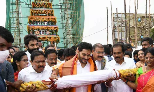 Chief Minister Y S Jagan Mohan Reddy pulls the newly-constructed chariot at Sri Lakshminarasimha Swamy temple at Antarvedi on Friday
