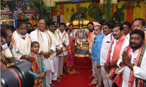 Legislative Council Chairman Gutha Sukender Reddy, Deputy Chairman Nethi Vidya Sagar and ZP Chairman Narender Reddy at the Brahmotsavams of Sri Parvathi Jadala Ramalingeswara temple at Cheruvugattu on Friday