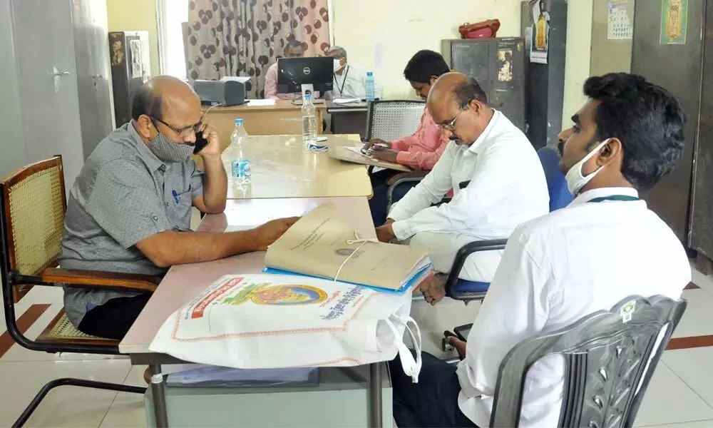 ACB officials inspecting records at Durga temple in Vijayawada on Saturday