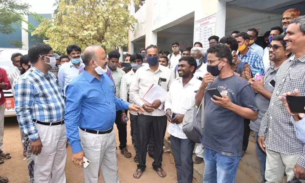 Collector M Hari Jawaharlal speaking to staff at Kothavalasa in Vizianagaram district