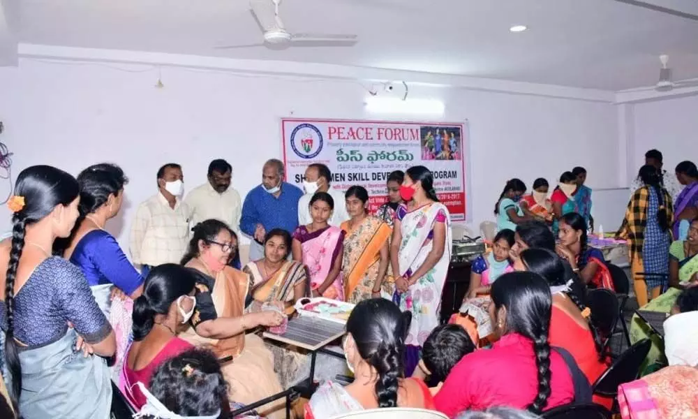 Trainers explaining how to make organic soap to SHG women at a skill development programme at Technical Training and Development Centre in Adilabad on Saturday