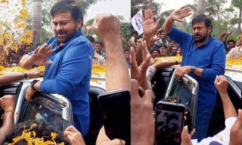 Cine hero Chiranjeevi greeting people from his car at airport in Rajamahendravaram on Sunday