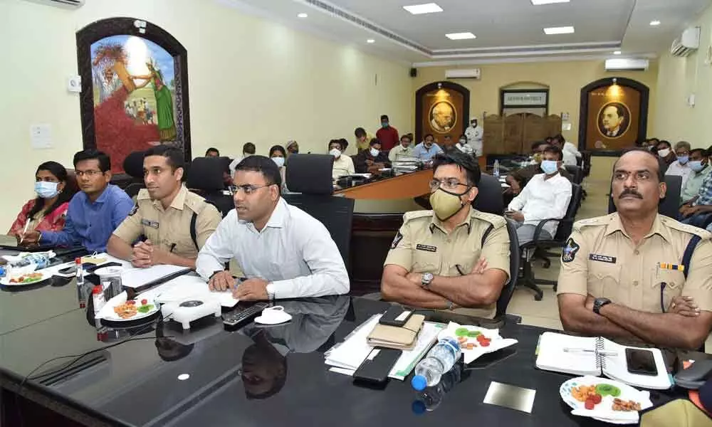 District Collector and District Election Officer Vivek Yadav participating in the videoconference from Collectorate in Guntur on Monday. Guntur Range DIG CM Trivikrama Varma also seen