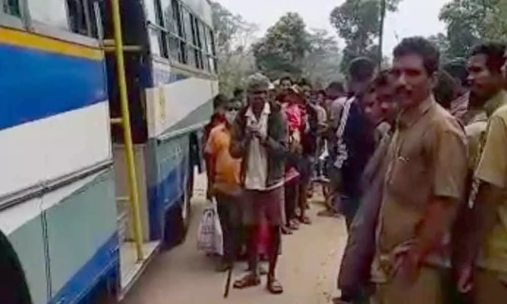 Tribals availing the new bus service as  part of the trial run at Korukonda