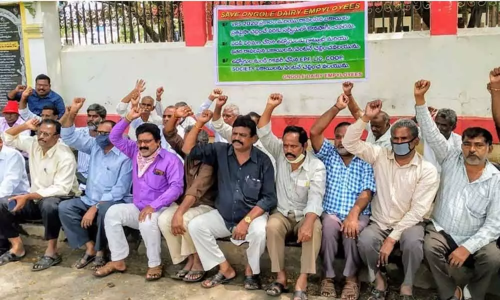 Ongole Dairy employees protesting in front of the Collectorate in Ongole on Monday