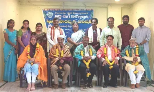 Saraswatha Sabha felicitating the guests to mark International Mother Tongue Day in Rajamahendrvaram on Monday.  YSRCP leader J Vijaya Lakshmi and Dr PVB Sanjeev Rao seen (standing).
