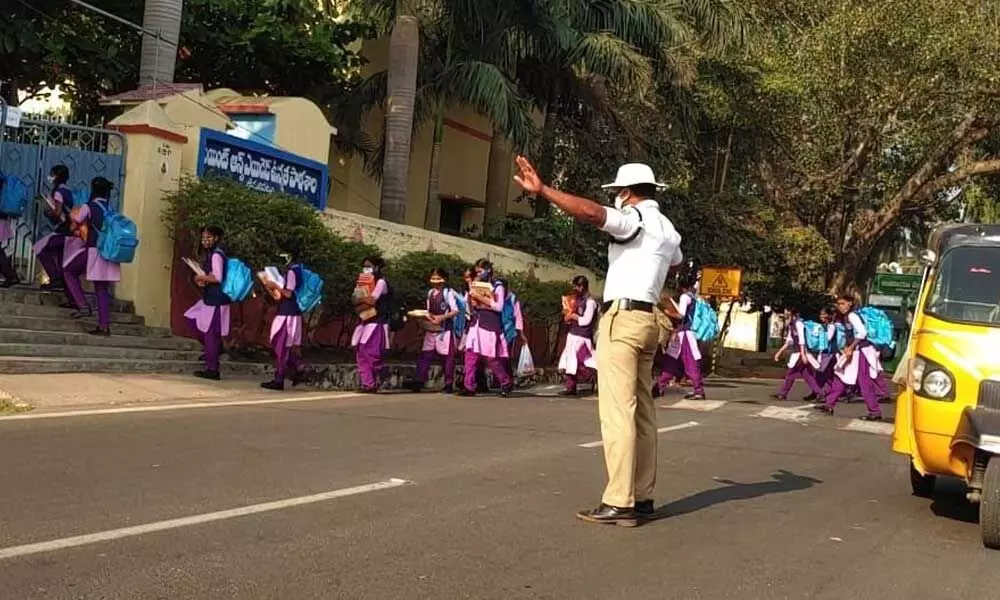 Traffic police creating awareness on road safety among school students in Visakhapatnam