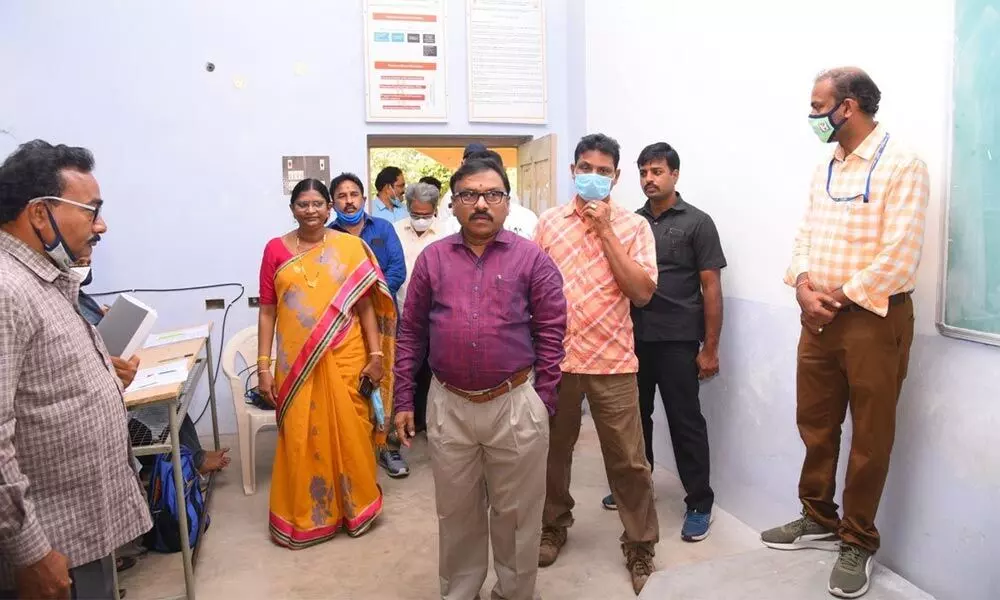 Collector Dr Pola Bhaskara inspecting rooms at St Anns College of Engineering in Chirala on Tuesday for setting up votes counting centre for municipal election