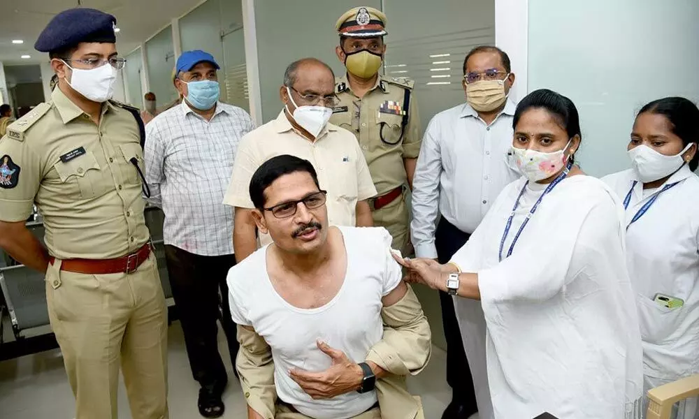 Police taking Covid vaccination shot at AR Grounds in Vijayawada in the presence of Krishna District Collector Md Imtiaz and Commissioner of Police B Srinivasulu on Tuesday